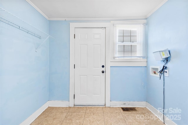 interior space featuring light tile patterned floors, baseboards, and ornamental molding