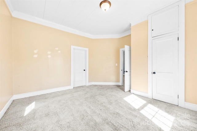 interior space featuring crown molding and baseboards