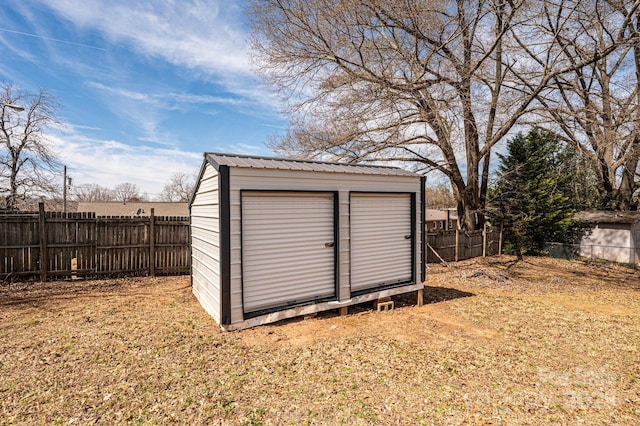 view of shed with a fenced backyard