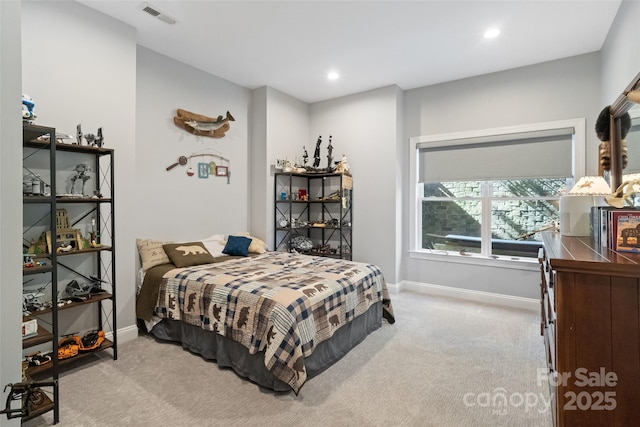 carpeted bedroom featuring recessed lighting, baseboards, and visible vents