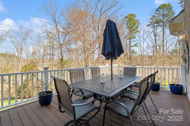 wooden deck with outdoor dining area