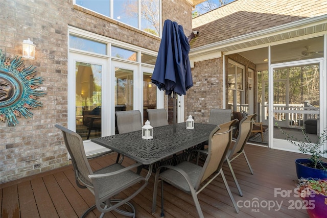 wooden deck featuring outdoor dining space