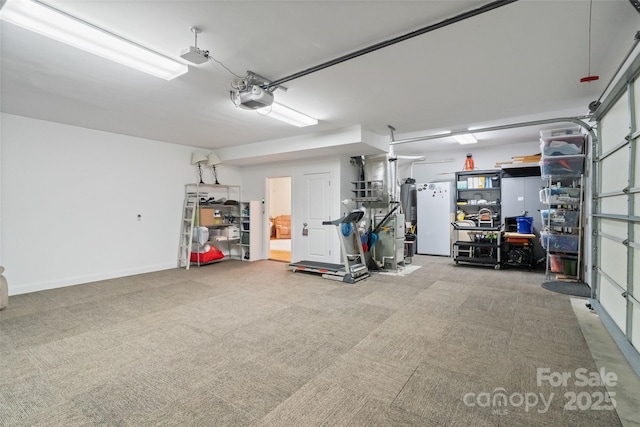 garage with gas water heater and a garage door opener