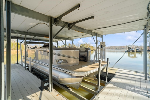 view of dock with a water view and boat lift