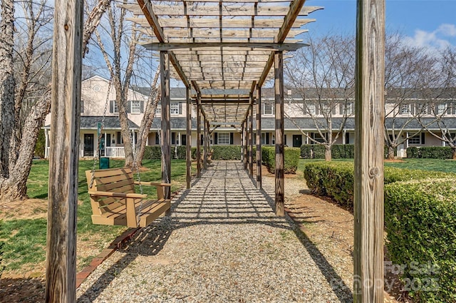 exterior space featuring a yard and a pergola