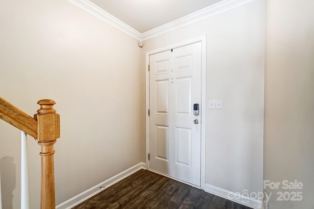entrance foyer featuring dark wood-style floors, baseboards, and ornamental molding