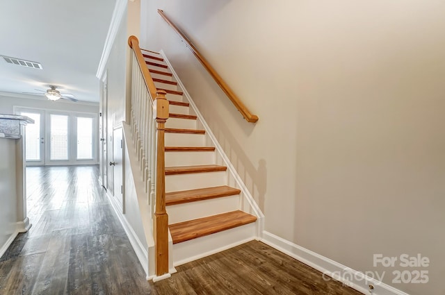 stairway with visible vents, a ceiling fan, wood finished floors, crown molding, and baseboards