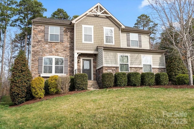 craftsman inspired home with stone siding and a front lawn