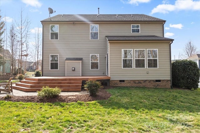 back of property with crawl space, a yard, and a deck