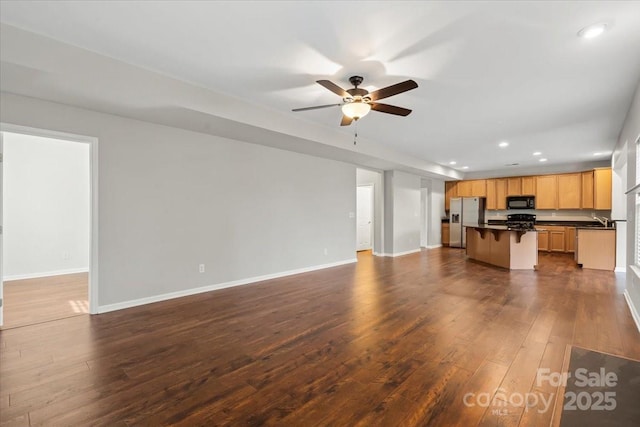 unfurnished living room with recessed lighting, baseboards, dark wood-type flooring, and a ceiling fan