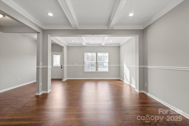 spare room with recessed lighting, beamed ceiling, baseboards, and wood finished floors