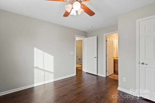 unfurnished bedroom featuring dark wood-style floors, a ceiling fan, and baseboards