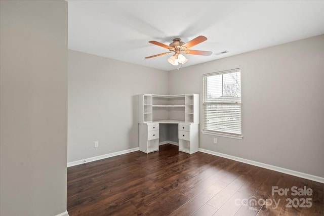 unfurnished bedroom with visible vents, a ceiling fan, baseboards, and dark wood-style flooring