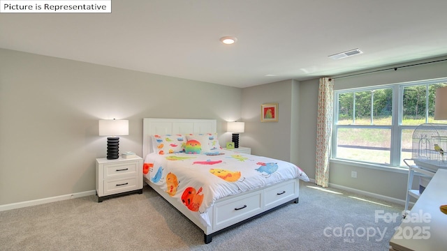 bedroom featuring light colored carpet, visible vents, and baseboards