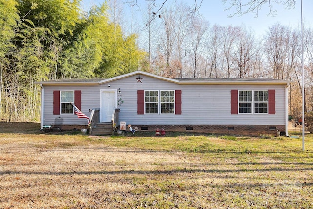 manufactured / mobile home featuring crawl space, a front yard, and entry steps