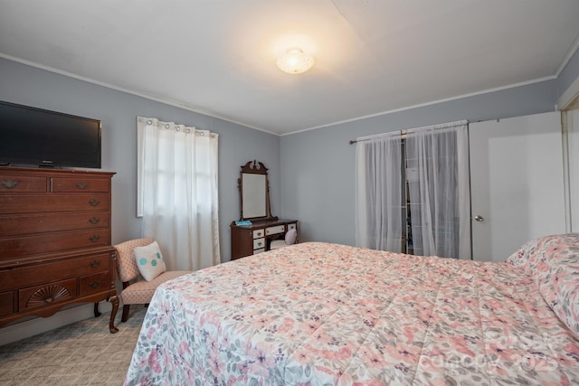 bedroom featuring crown molding and light carpet