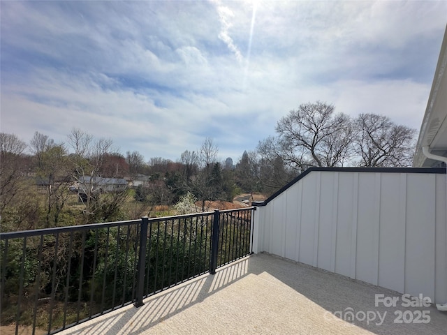 view of patio featuring a balcony