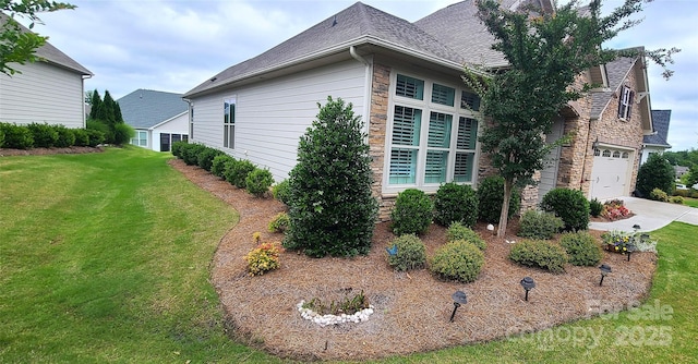 17436 Langston Dr, Charlotte, NC 28278 - view of side of property with a lawn, stone siding, concrete driveway, and a shingled roof