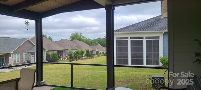 17436 Langston Dr, Charlotte, NC 28278 - unfurnished sunroom featuring beam ceiling and a residential view