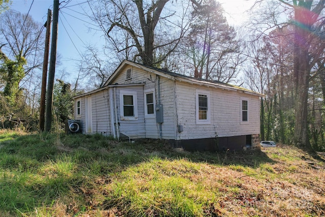 view of home's exterior with ac unit