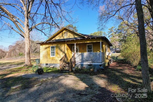 bungalow-style house featuring crawl space and a porch