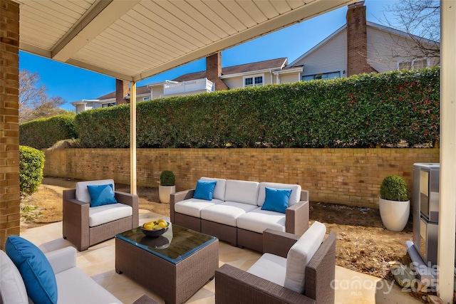 view of patio / terrace featuring a fenced backyard and an outdoor hangout area