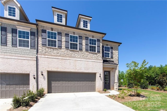 view of front facade featuring concrete driveway, brick siding, a garage, and stone siding