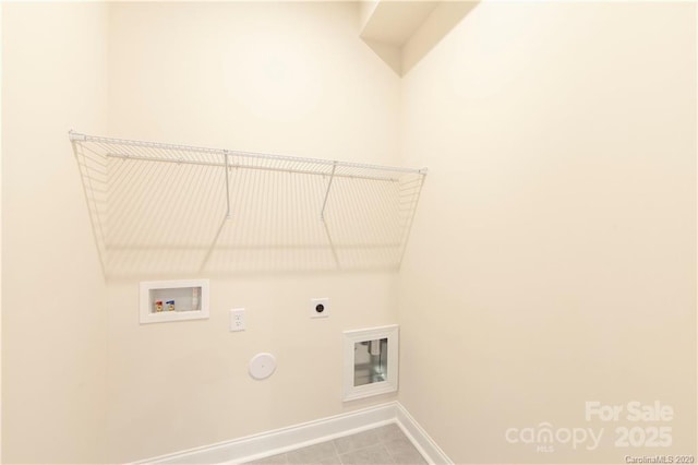 washroom featuring electric dryer hookup, washer hookup, hookup for a gas dryer, baseboards, and laundry area