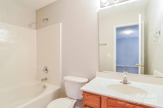 full bathroom with shower / bathing tub combination, toilet, vanity, and a textured ceiling