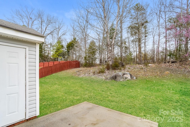 view of yard with a patio and fence