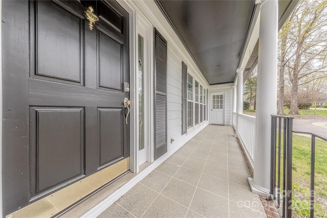 doorway to property featuring covered porch