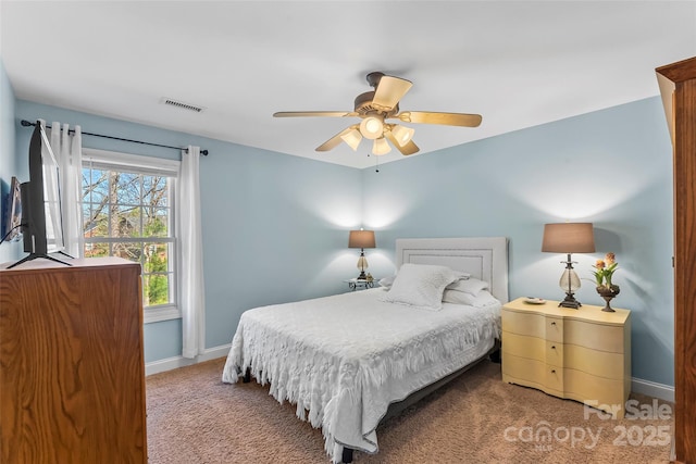 bedroom featuring a ceiling fan, carpet, baseboards, and visible vents