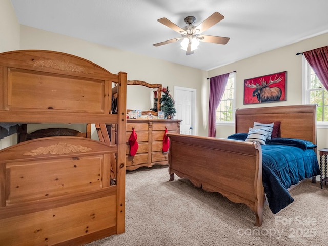 bedroom with light colored carpet and ceiling fan