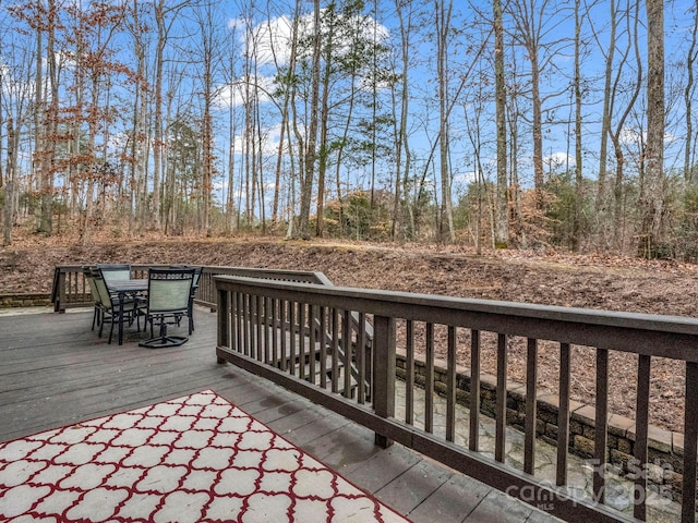 wooden deck with outdoor dining area