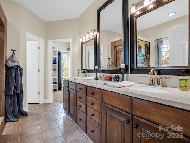 39 W Rambling Crk, Tryon, NC 28782 - bathroom featuring double vanity, a sink, baseboards, and tile patterned flooring