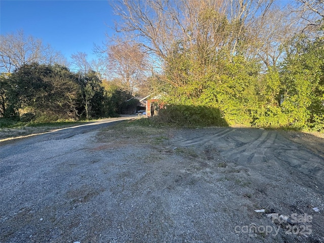 view of road with driveway