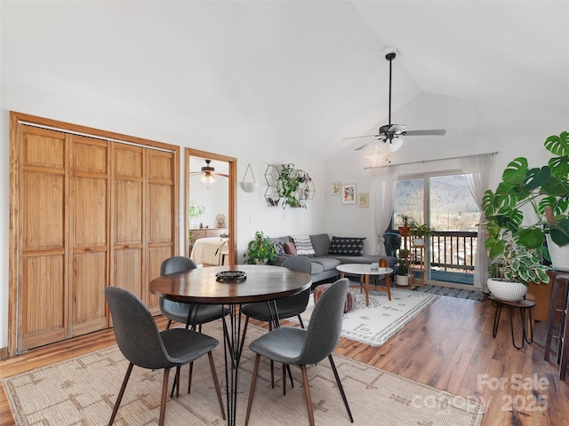 dining area featuring lofted ceiling, light wood-type flooring, and ceiling fan