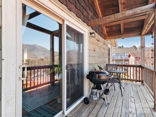 balcony featuring a mountain view and area for grilling