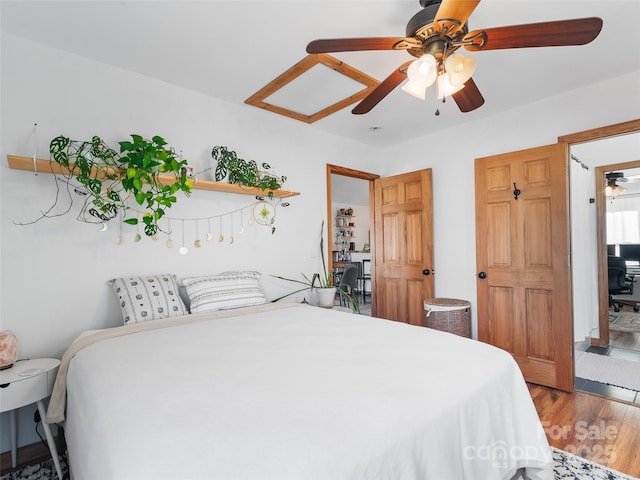 bedroom featuring ceiling fan and wood finished floors