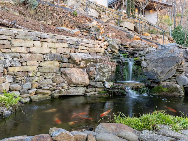 exterior details featuring a garden pond