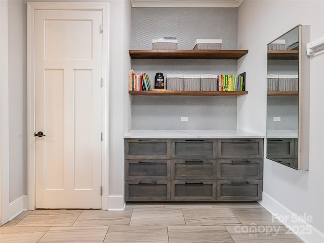 interior space featuring baseboards