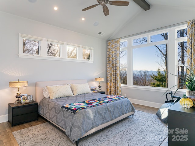 bedroom with visible vents, wood finished floors, recessed lighting, baseboards, and vaulted ceiling with beams