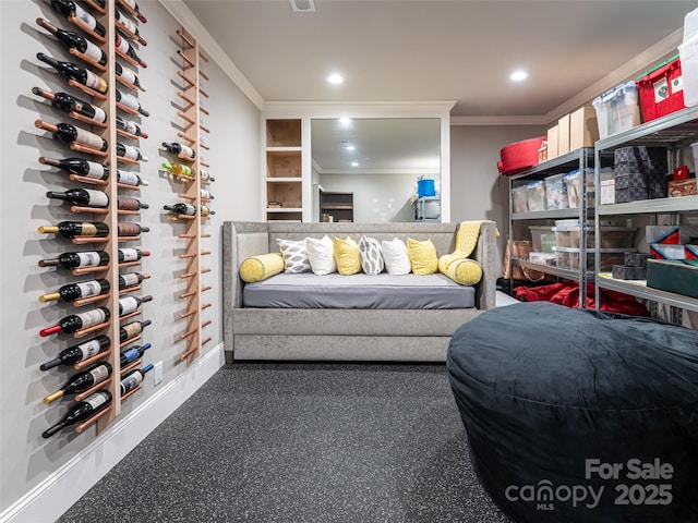 wine room with visible vents, recessed lighting, and crown molding