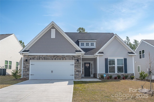 craftsman-style home with driveway, a front lawn, stone siding, a shingled roof, and a garage