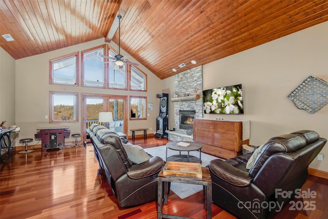 living area featuring a fireplace, wooden ceiling, wood finished floors, and high vaulted ceiling