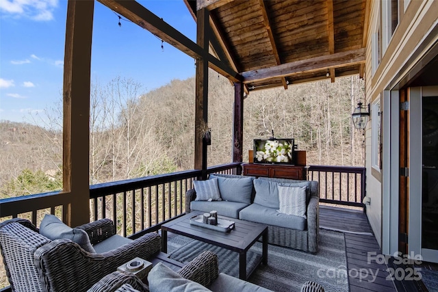 wooden deck featuring an outdoor living space