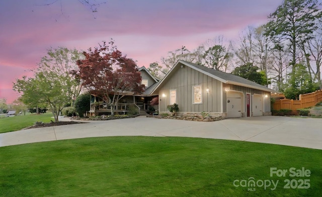 1620 London Rd, Mooresville, NC 28115 - view of front facade with board and batten siding, concrete driveway, and covered porch
