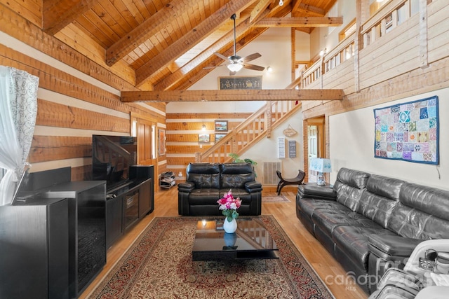 1620 London Rd, Mooresville, NC 28115 - living room with stairs, high vaulted ceiling, ceiling fan, wood finished floors, and beamed ceiling