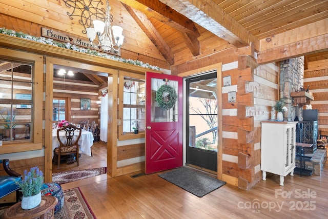 1620 London Rd, Mooresville, NC 28115 - entrance foyer featuring wood walls, a chandelier, wood ceiling, healthy amount of natural light, and hardwood / wood-style flooring