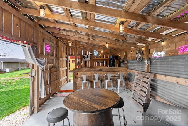 1620 London Rd, Mooresville, NC 28115 - misc room featuring concrete flooring, a dry bar, and lofted ceiling